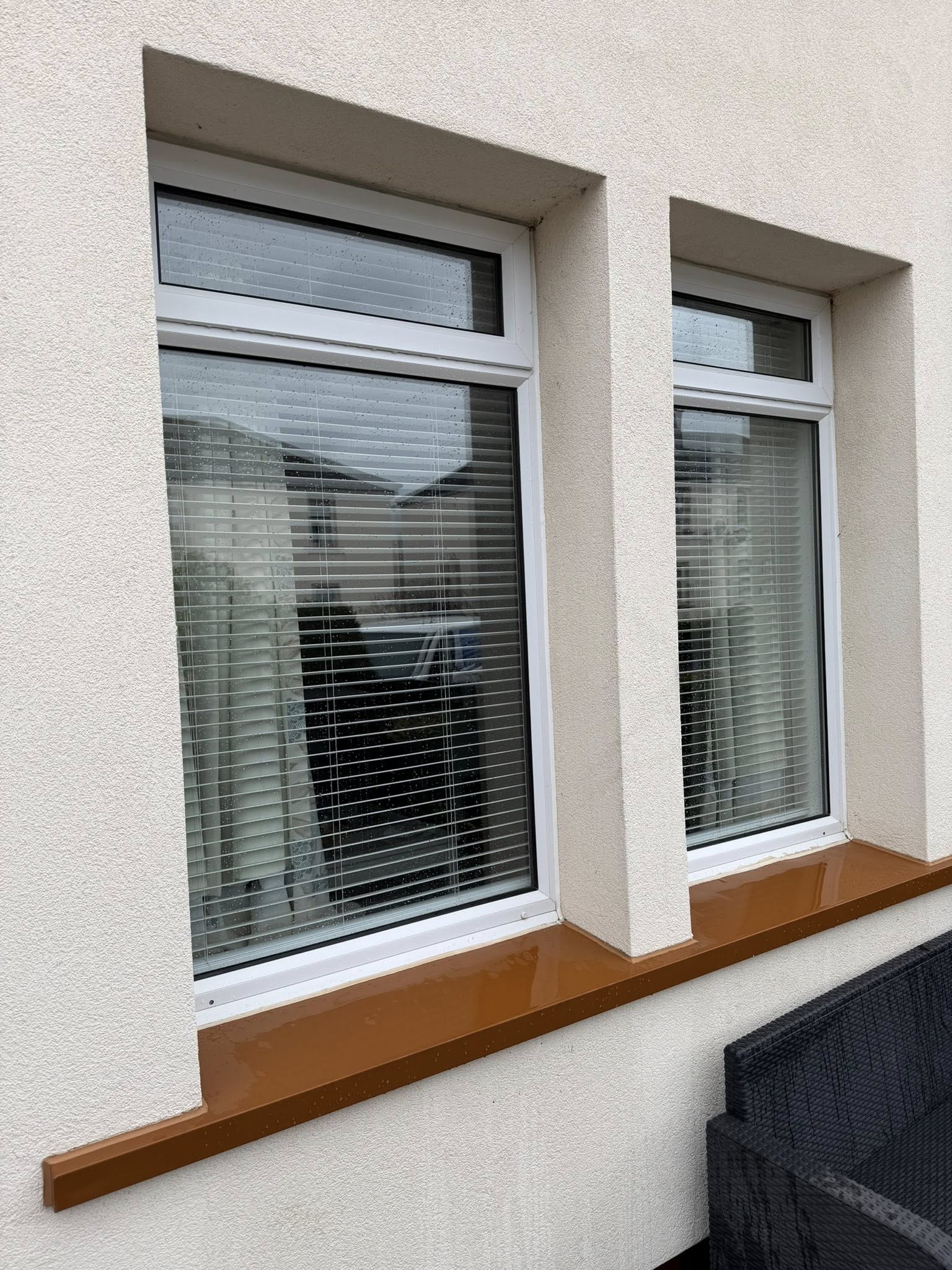 dual pvc windows with brown window sills